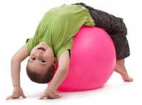 photo of kid on exercise ball