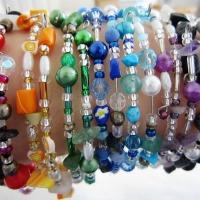 photo of multicolored beaded bracelets on wrist