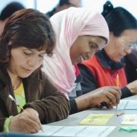 photo of adults writing